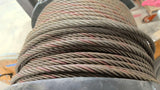 Portable Wire Rack Dispenser With 3 Rolls of wire as pictured