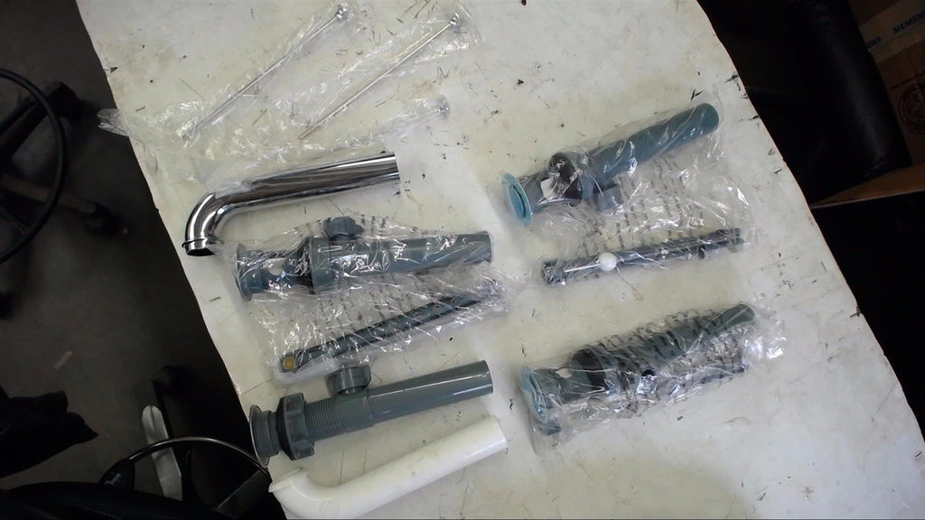 LOT OF ASSORTED RESTROOM REPLACMENT PARTS SELLING AS PCITURED